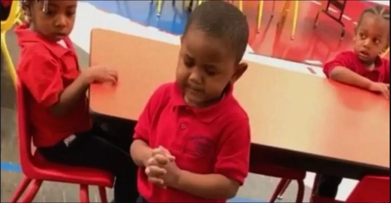 Tiny three-year-old stands up in front of his friends to pray