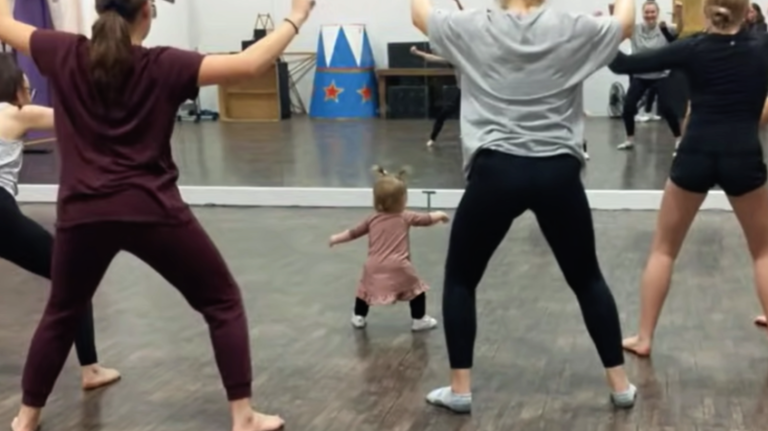 A 2-year-old girl showed adults how to dance.