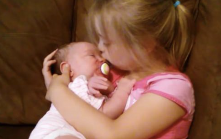 5-Year-Old Charmingly Cuddles Her New Baby Sister To Sleep