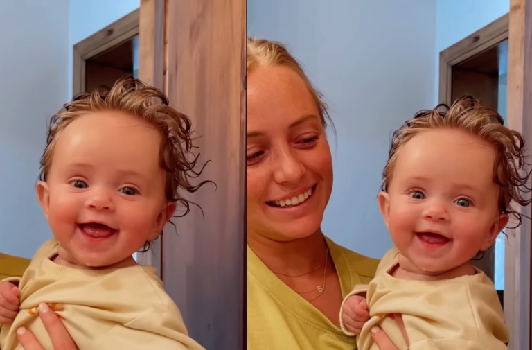 Little baby girl smiling when dad says she is beautiful