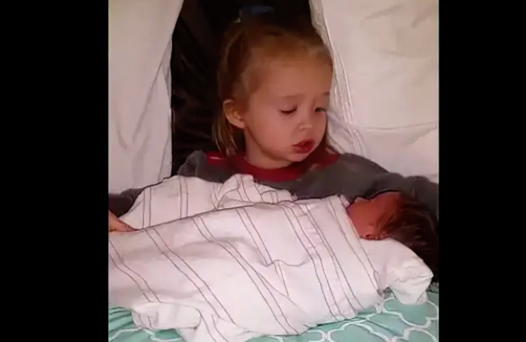 Sister Puts Newborn Brother to Sleep Singing an Adorable Version of ‘Baby Mine’