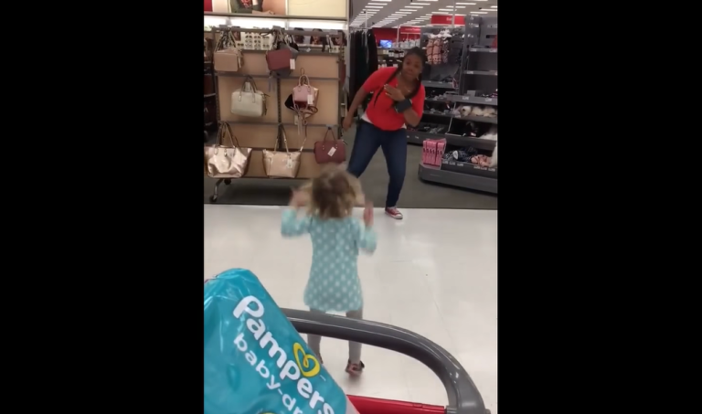 Target employee challenges little girl to a dance off