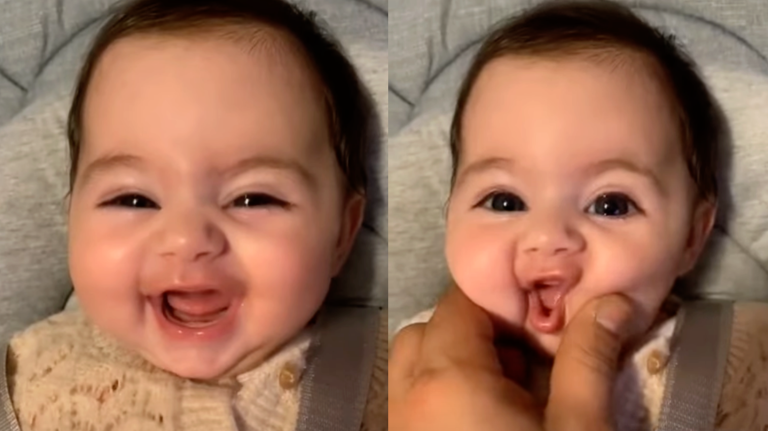 Adorable Baby Smiles For The Camera While Playing With Daddy