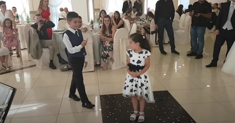 2 kids step onto dance floor for iconic movie routine that has guests cheering