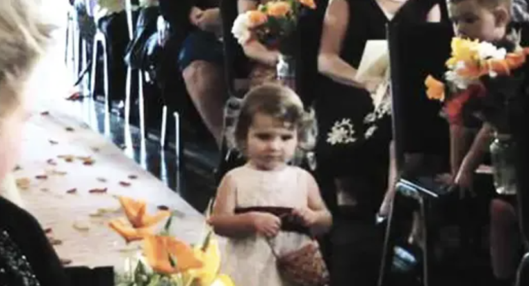 Flower Girl Walks Into the Aisle And Stays Still At The Middle – Pay Attention To Her Basket