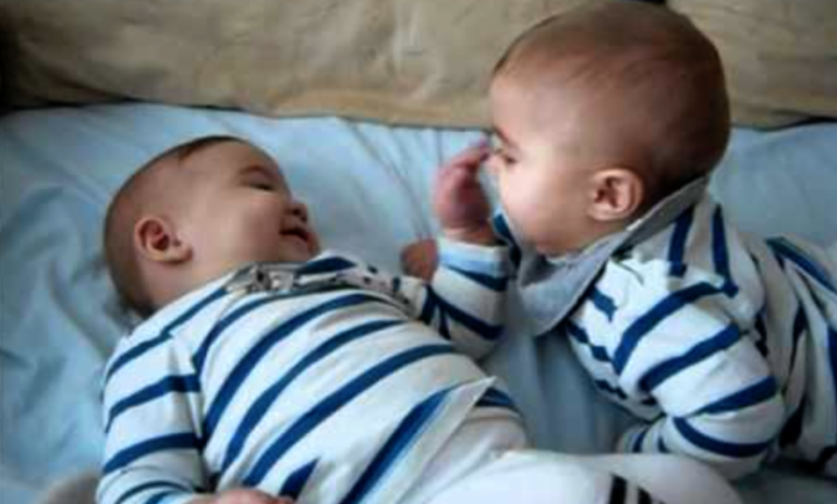 Twin Babies Laughing And Having Fun: