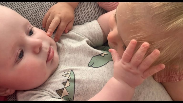 Big Sister’s Loving Hug To Her Little Brother. A Heartwarming Display Of Sibling Affection