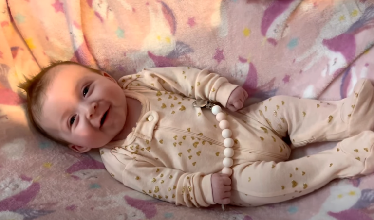 Pure Joy: Happy Baby Beams From Crib!