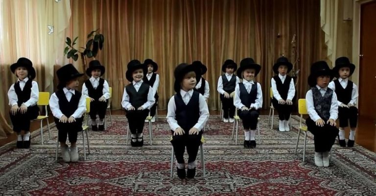 12 tiny girls put on top hats and deliver the cutest jazzy dance