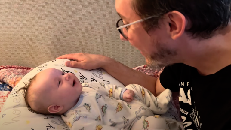 Heartwarming Moments: Sweet Newborn Baby Cooing with Daddy