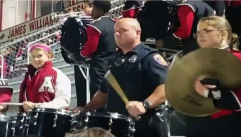 Teen dares cop to drum in high school band – he nails his performance