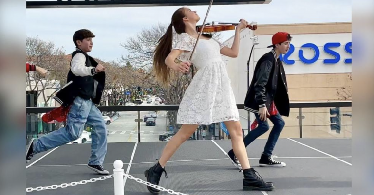 Young girl plays “Footloose” on violin while others dance but then she jumps in