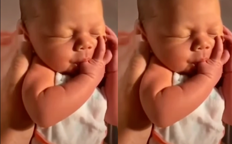 Newborn baby Sucking Its Thumb at First Bath