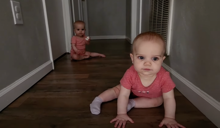 Double the Fun: Adorable Baby Girl Twins’ Playtime in the Hallway