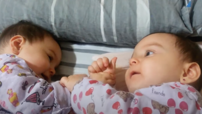 Double the Cuteness: Twin Baby Girls Share Adorable Eye Contact