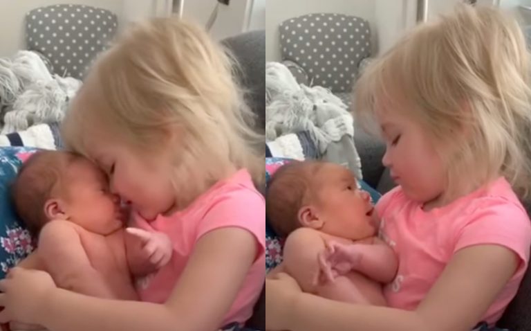 Toddler Loves Holding Newborn Baby Sister