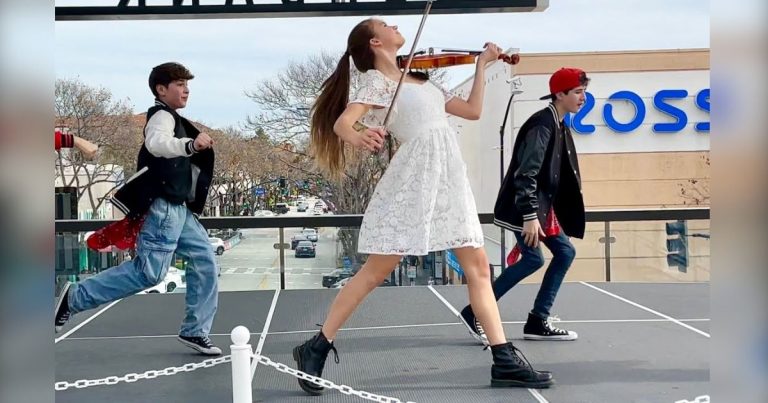 Young girl plays “Footloose” on violin while others dance but then she jumps in