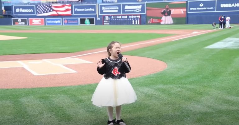 8-year-old girl pours everything she has into singing Star Spangled Banner at WooSox game