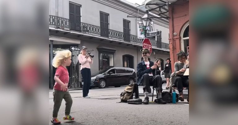 Adorable little girl with “pep in her step” spots street band and quickly steals the show