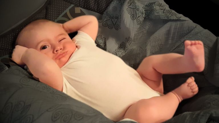 Sweet Morning Stretch: Adorable Baby Boy Wakes Up