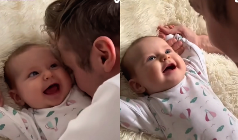 Little baby girl playing with her daddy, giggling and laughing—a truly precious moment