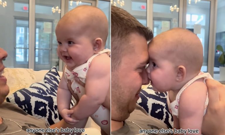 Waking up and smiling at Daddy: the baby girl enjoys time with Daddy