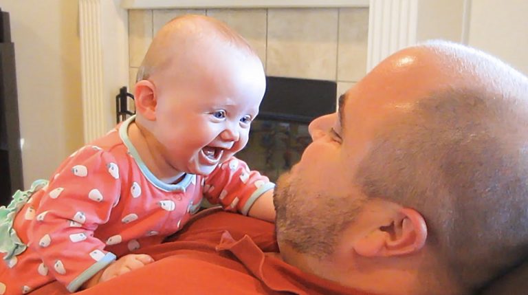 Beautiful little baby enjoys every moment with her father! This is true happiness !