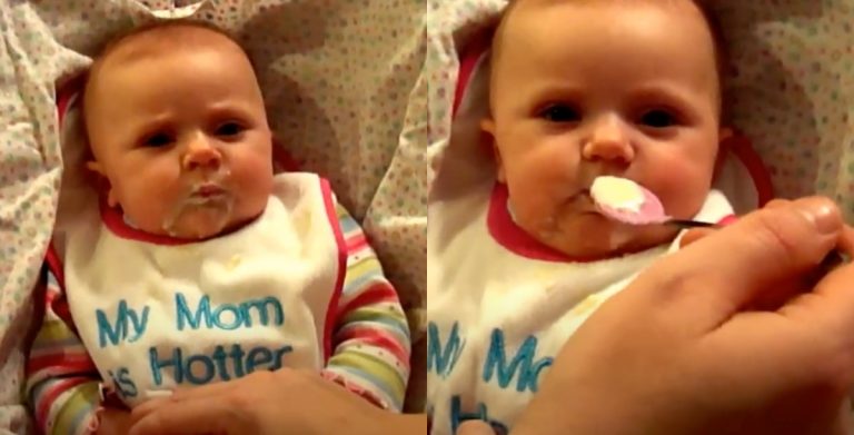 Maddie eating her first few spoonfuls of rice cereal.